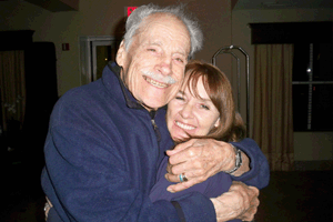 Dick Richards (Drummer for Bill Haley's Comets) gives Jimmy Jay's wife  a big bear hug!